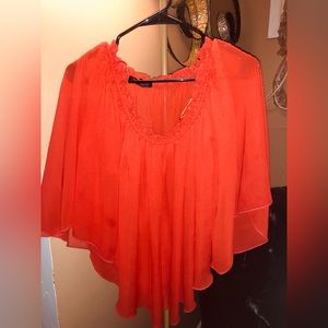 Pretty blouse to wear with a pair of jeans or dress slacks! Light material.